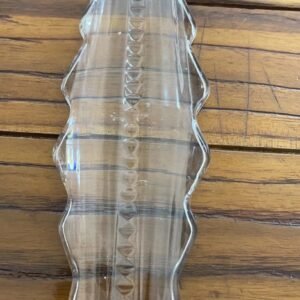 A beautifully crafted glass lamp shade with intricate geometric designs, showcasing a translucent surface that diffuses light. The shade features smooth edges and a hollow construction for easy mounting, perfect for enhancing the ambiance of any room.